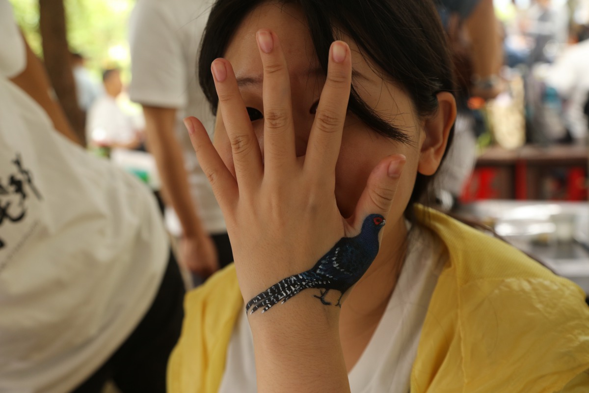 一年一度的台北國際賞鳥博覽會即將登場,圖為博覽會中酷炫人體彩繪。台北市野鳥學會/提供